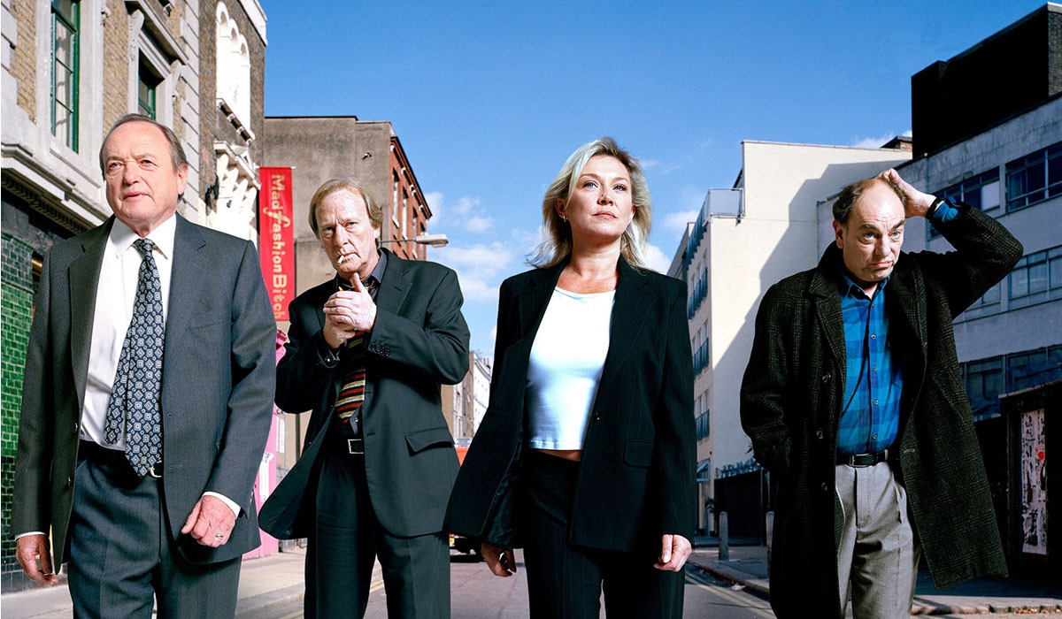 Four people standing in street