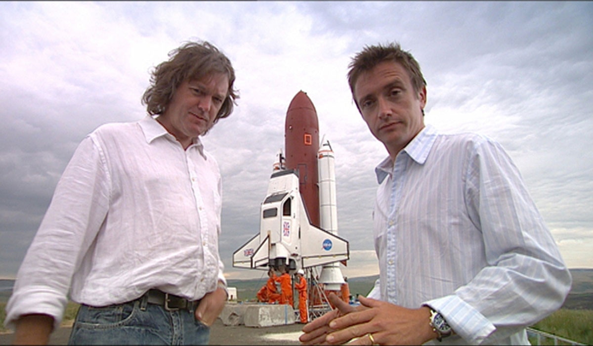 Top Gear Hosts in front of rocket ship