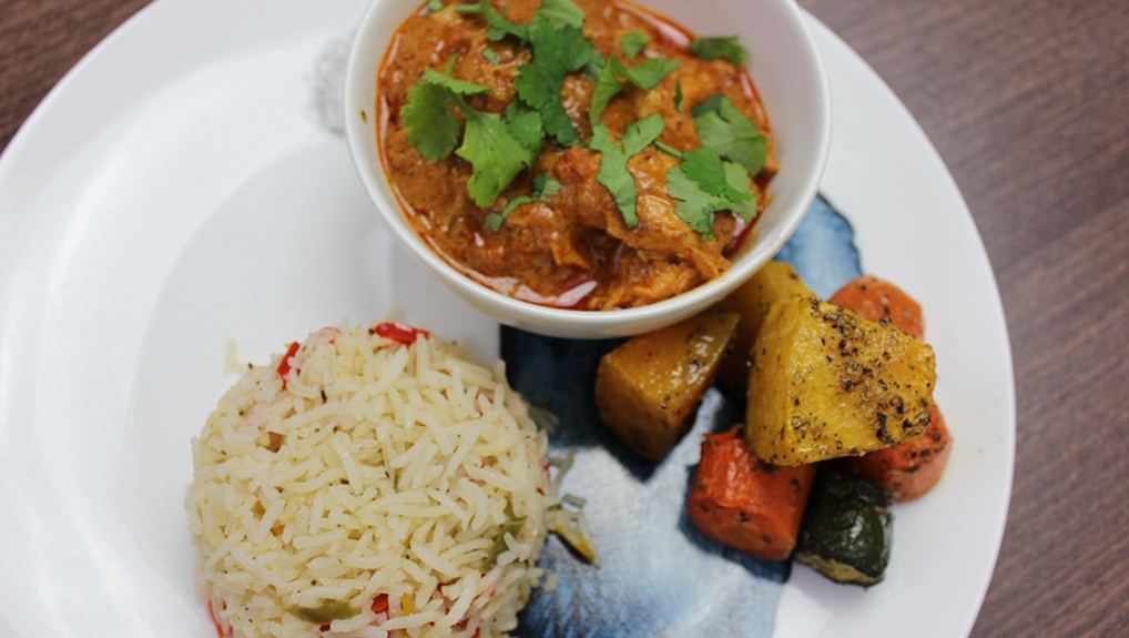 Buttered Chicken and basmati rice with sauteed peppers
