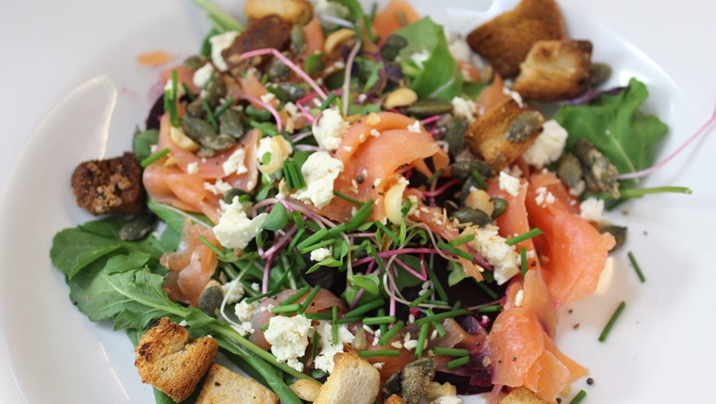 Salmon Salad on bedded beetroot and rocket leaves with croutons